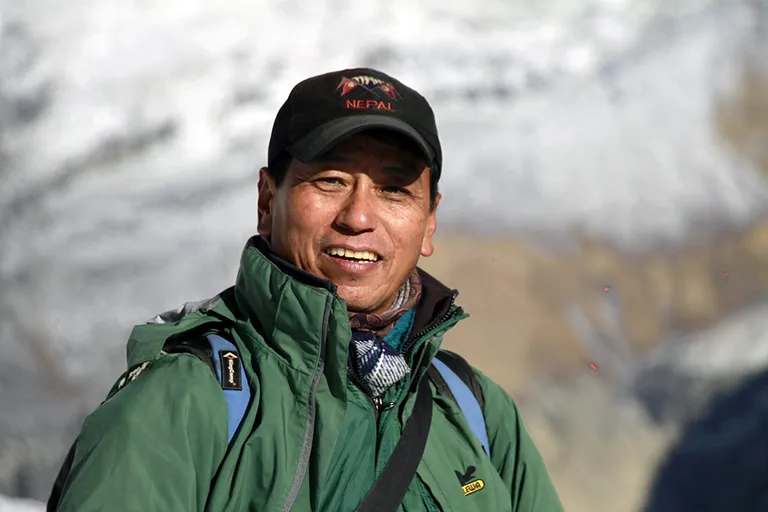 Vimal Kumar Thapa with binoculars in the field